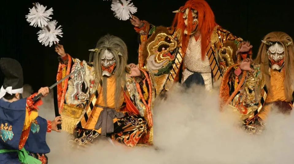 men at kagura theater no and each wearing a Japanese demon mask with horns. As well as kimono. The Oni face a samurai raising his Katana sword.